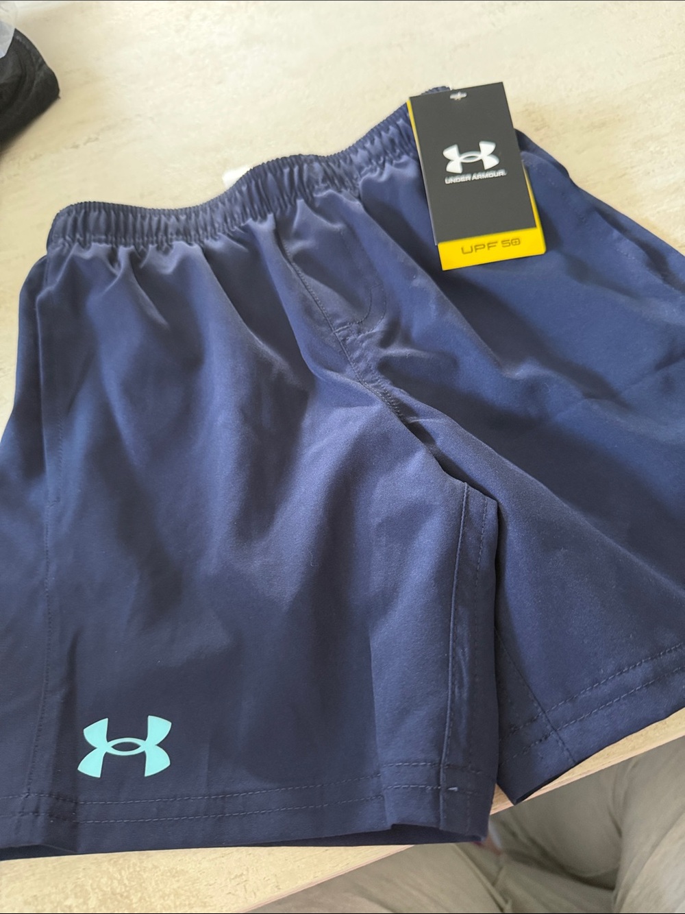 Under Armour Navy Athletic Shorts with Light Blue Logo. Underlining for swim.